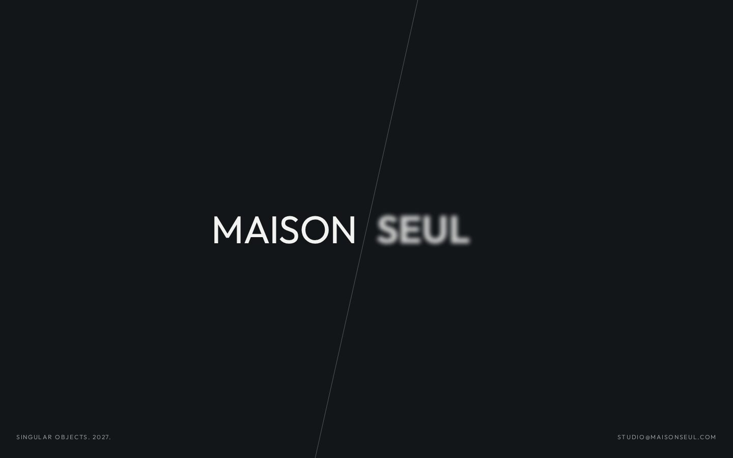 The Maison Seul home page on a laptop and a phone: the name on a dark page.